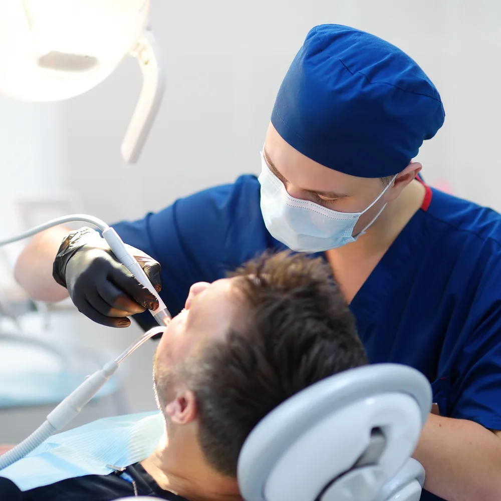 A dentist treating a patient